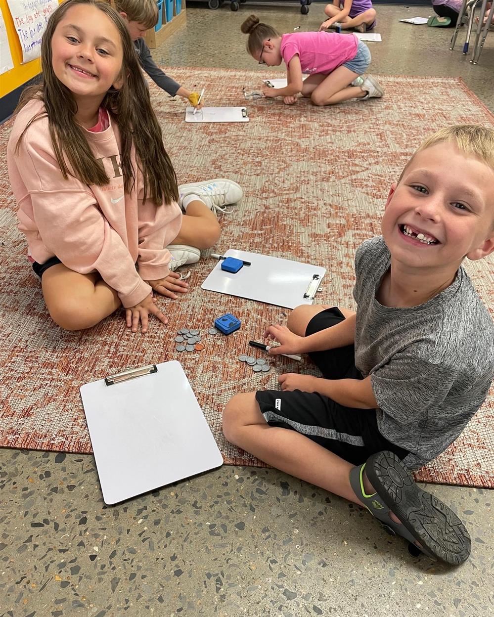  students working on money